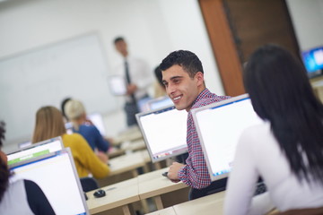 students group in computer lab classroom