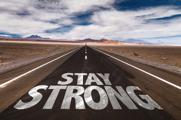 Stay Strong written on desert road