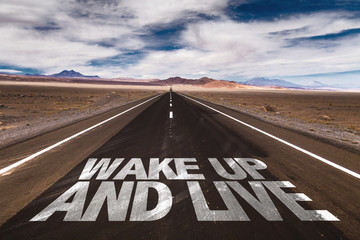 Wake Up and Live written on desert road