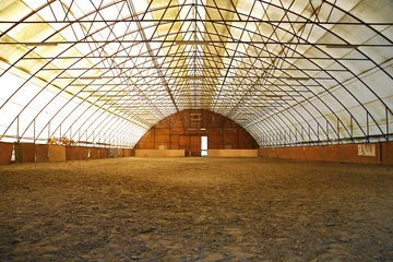 Acrylic prints Horse riding  Indoor riding arena covering sand for trainings