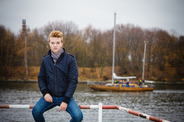 Fototapeta premium Young handsome man model casual style hair styling outdoor