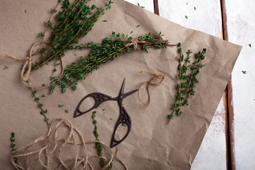 sprigs of thyme dismantled on a brown paper © zadveri