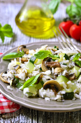 Rice with fried zucchini and mushroom.