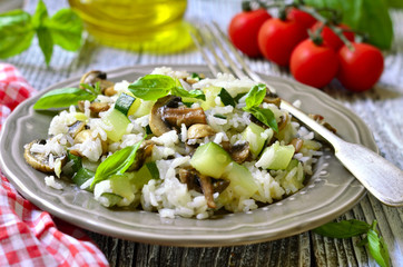 Rice with fried zucchini and mushroom.