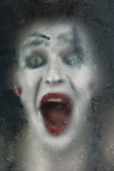 Scary face screaming mime for murky glass © korionov