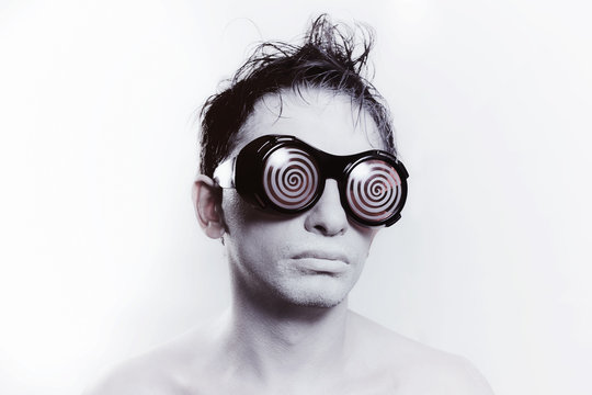 young man with white skin in strange glasses
