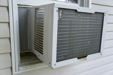 Window Air Conditioner Working To Keep Things Cool.