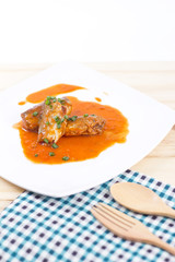 Canned fish in tomato sauce