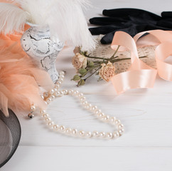 Women's retro accessories including velvet gloves and pearl necklace