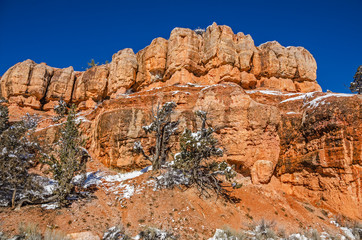 Fototapeta premium Orange Rock Formations Against Blue Sky