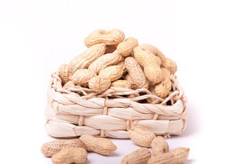 peanuts isolated in basket on white background