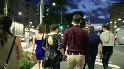 People going to the party at night, steadycam shot
