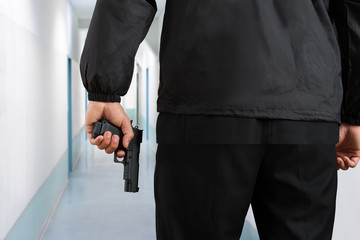 Security Guard Hands With Pistol