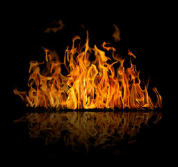 dark and bright orange fire on black with reflection