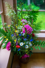 Fototapeta na wymiar Beautifull Ligo bouquet. Midsummer celebration in june.