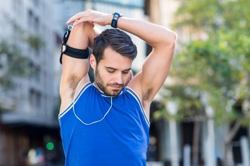  An handsome athlete listening to music