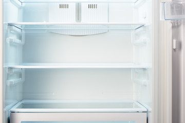 White open empty refrigerator. Weight loss diet concept.