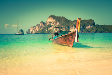 Fototapeta na wymiar Long boat and tropical beach, Andaman Sea,Phi Phi Islands,Thaila