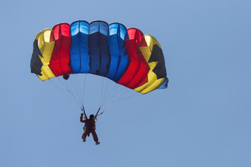 Paraglider flying in summer day