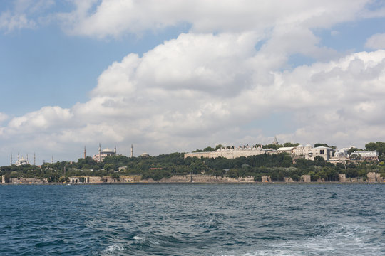 view of the Saray Burnu with Topkapı Palace, Sultan Ahmet mosque (Blue Mosque) and Hagia Sofia from the Bosphorus straits, Istanbul, Turkey
