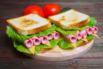 sandwich with ham, cheese and lettuce