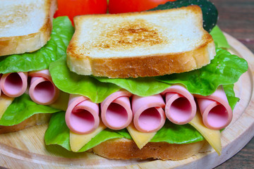 sandwich with ham, cheese and lettuce