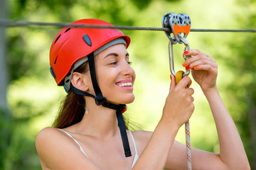 Woman riding on a zip line © rh2010