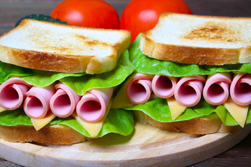 sandwich with ham, cheese and lettuce