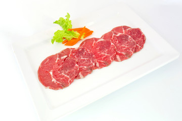 High grade sliced Hida wagyu beef isolated on white background