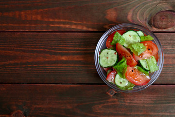 Fresh salad with tomatoes, cucumbers and lettuce