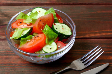 Fresh salad with tomatoes, cucumbers and lettuce