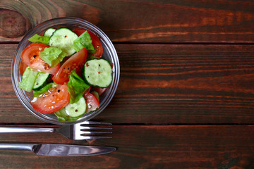 Fresh salad with tomatoes, cucumbers and lettuce