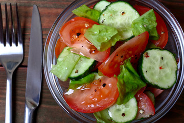 Fresh salad with tomatoes, cucumbers and lettuce