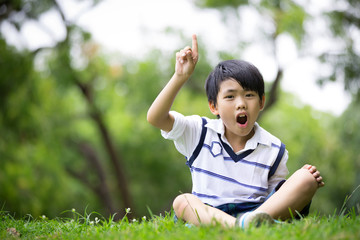 Portrait of a little asian boy in the park