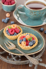 Delicious breakfast with fruit tartlets