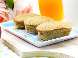 egg cake coffee flavor and red apple on sweet polka dot background