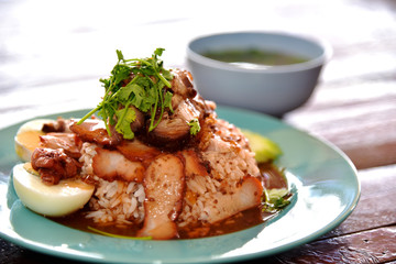 Barbecued red pork in sauce with rice