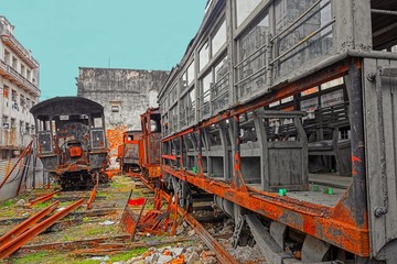 Rusty and old steam locomotives and freight cars abandoned in a yard in central Havana, Cuba. 