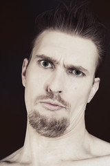 man with blue eyes and a stylish hairstyle