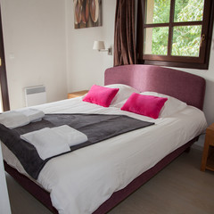 Interior of arranged double bed in a room