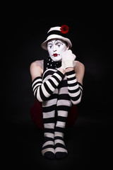 Mime in a white hat