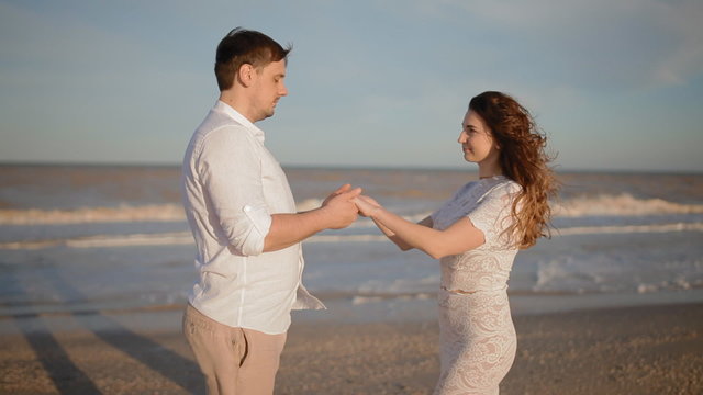 White couple on the seaside show their feelings
