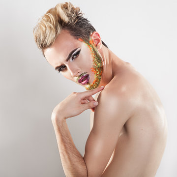 Square photo of young male model with multicolor beard