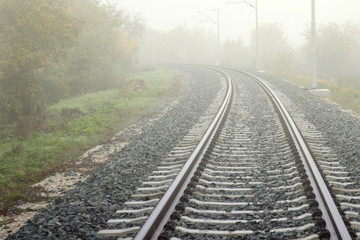 Railway track line in mist