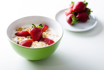 Homemade fruit plate with yogurt, strawberries on white backgrou