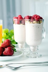 Glass of dessert with fresh berries, muesli and yogurt