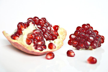 Fresh juicy pomegranate on white background