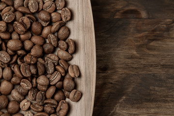 Background coffee. Roasted beans on old wooden background