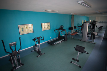 Fototapeta na wymiar Interior view of a gym with equipment.