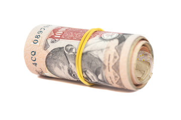 Roll of Indian rupees isolated on white